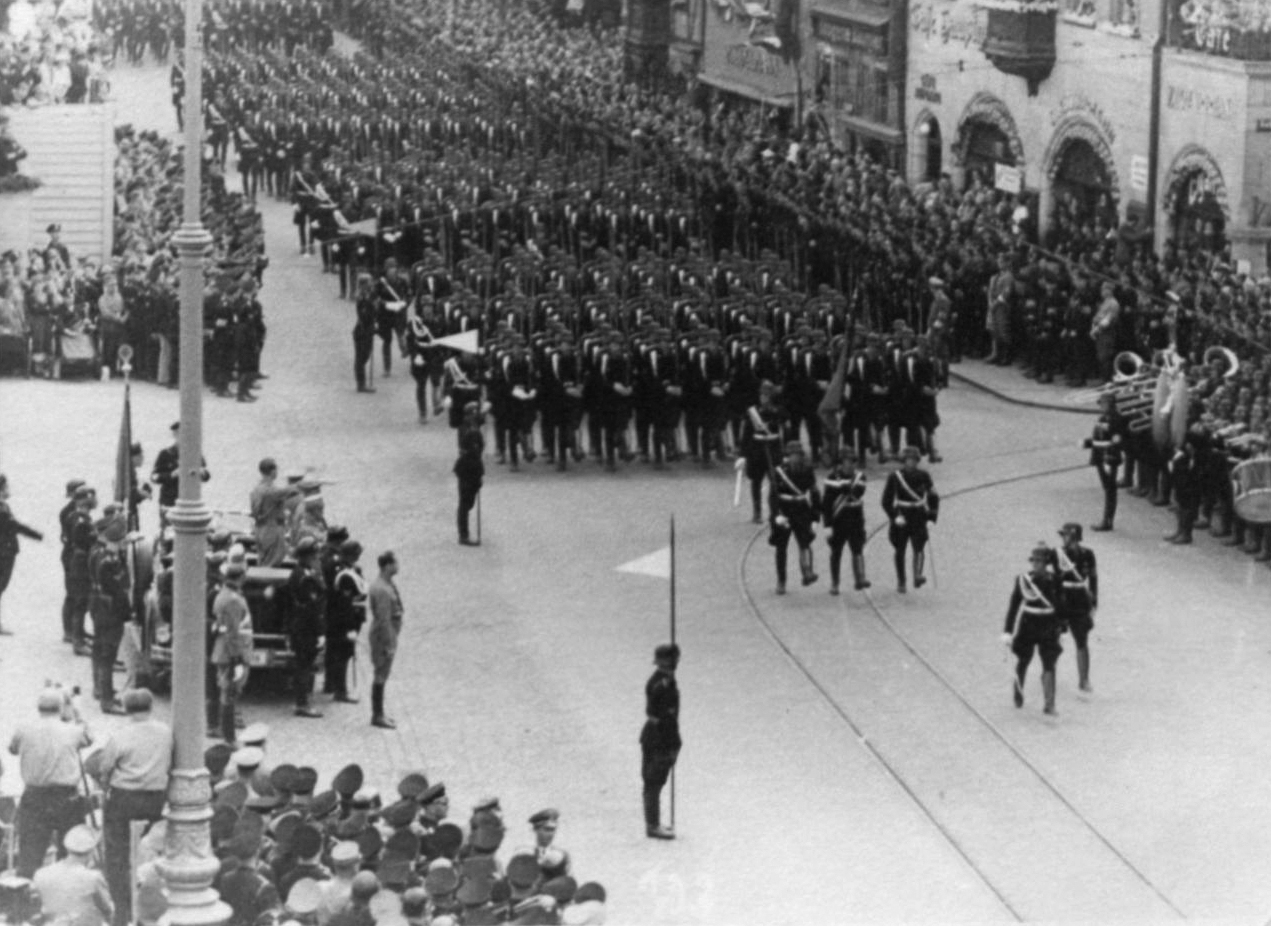 Adolf Hitler salutes the SA march at the 1936 RPT 